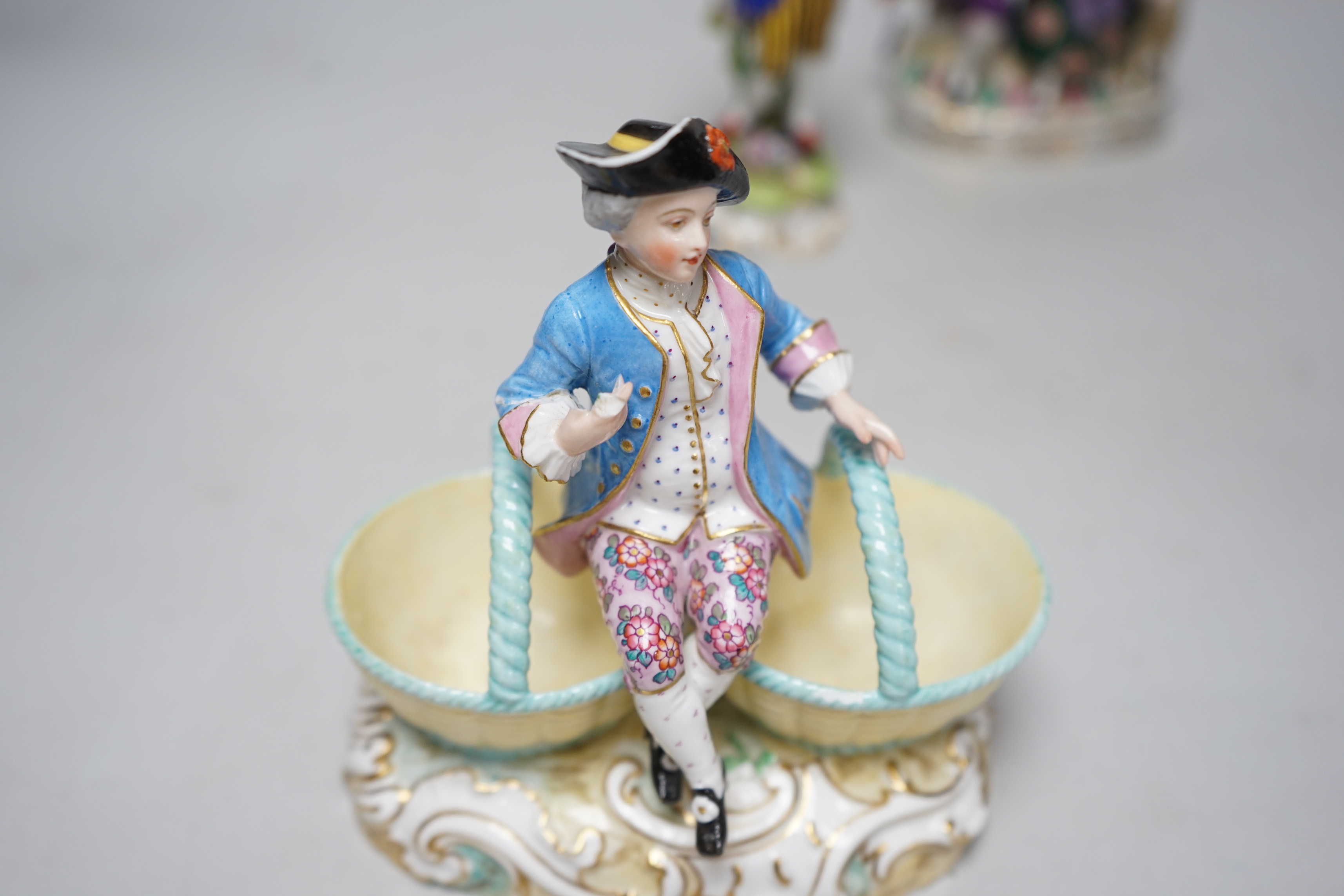 A group of continental porcelain figures, tallest 23cm